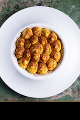 Classic italian dessert, tiramisù. An cheescake with cocoa, eggs, coffee and italian biscuits, savoiardo.