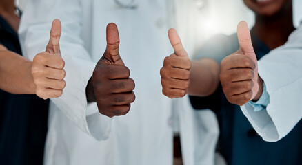 Doctors, hands and thumbs up in hospital for healthcare, teamwork and support vote. People, medical...