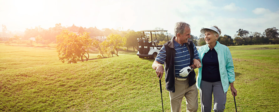 Golf, outdoor and senior couple on course for sports at country club together for leisure activity. Lensflare, happy and elderly man and woman people playing game in retirement for bonding in nature.