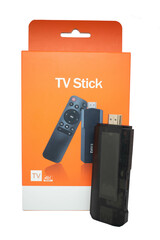 TV stick next to product box without logo without brand ready to use in marketing selective focus, copy space