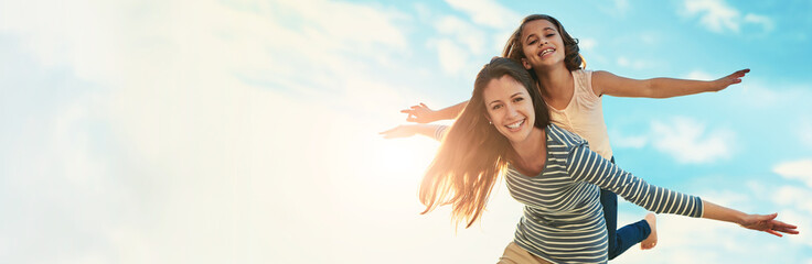 Portrait, piggy back and mother with girl, outdoor and bonding together with happiness. Banner, family and parent with mama carrying daughter, freedom and space with love, flying and summer holiday