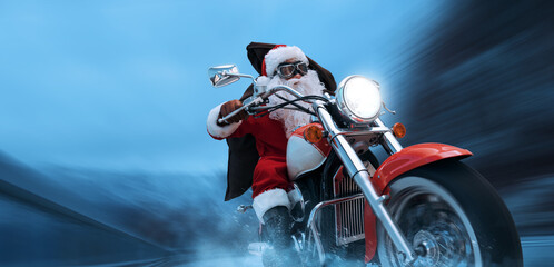 Fototapeta premium Biker Santa Claus delivering Christmas gifts