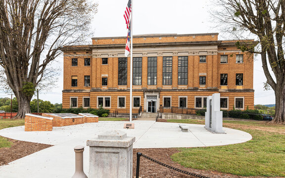 MARION, NC, USA-15 OCT 2019: McDowell County Courthouse in Marion, with two probation officers exiting the front door.