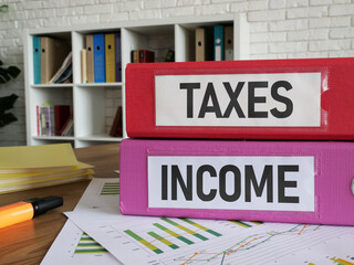 Income Tax is shown as business and financial concept. Financial research, government taxes and calculation tax return