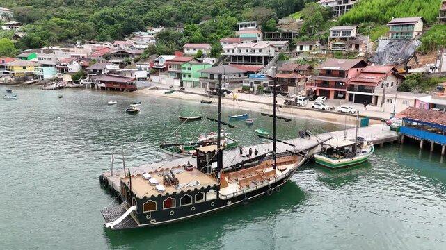 Tourist schooner anchored at the pier at Ara&ccedil;a Beach - Porto Belo, Santa Catarina, Brazil