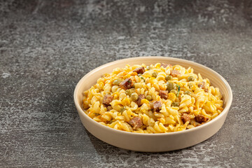 Plate of pasta salad on the table. Macaroni salad.