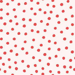 Red hand drawn polka dots on light background. Seamless pattern with dots for wrapping paper, fabric, scrapbooking.
