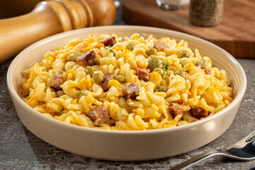 Plate of pasta salad on the table. Macaroni salad.