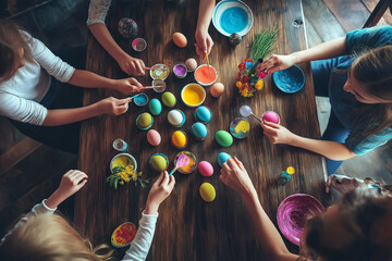 Cheerful family gathering around a table, decorating Easter eggs with bright paints and stickers.