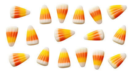 Obraz premium Candy corn pieces scattered on a white background
