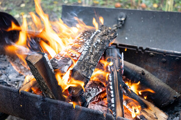 Fire and Flame. Burning charcoal barbecue grill. Bright flame and fire from burning woods