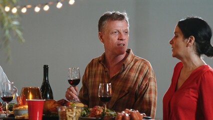 Family together for holiday celebration in garden. Old romantic senior drink wine have dinner. Outdoor camping activity, celebrate and spend time with lovely couple strengthen family bond. Divergence.