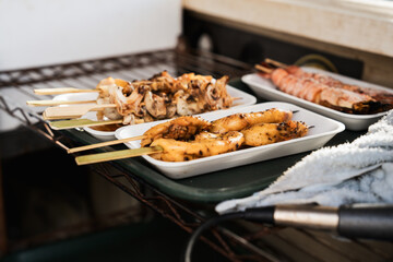 Seafood, oysters grilled, squid and scallop grilled, Matsushima fish market, Sendai, Japan, 21 October 2024. Japanese travel destination. freshness.