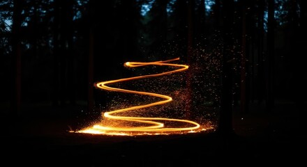 Obraz premium Enigmatic fire spiral illuminating the night