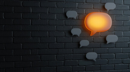 glossy message bubble glowing against black brick wall creates striking visual. This design element symbolizes communication and interaction in modern setting