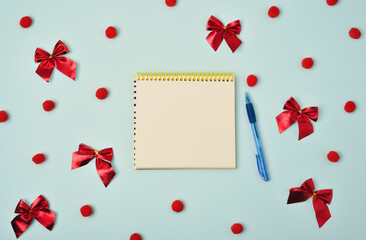 Christmas holiday concept. Blank sheet of paper with pen on blue background with Christmas decorations. Santa s List Day