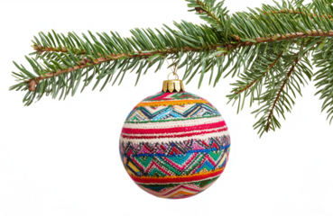 a beautifully decorated christmas bauble hanging on a fir branch over transparent background