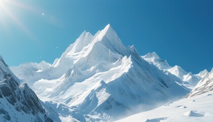 Majestic snow-covered mountain peaks with clear blue sky and shining sun