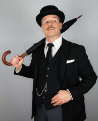 English Gentleman in Formal Suit and Bowler Hat Regarding the Unwashed Masses with Disdain. Vintage Style of Classic Wealthy British Businessman.