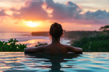 Woman Enjoying a Serene Sunset from a Tranquil Infinity Pool