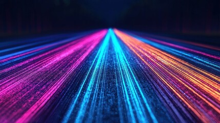 Vibrant Nighttime Road with Dynamic Light Trails in Blue, Pink, and Orange Colors Creating a Futuristic and Energetic Atmosphere for Travel and Adventure Themes