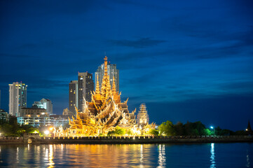 Sanctuary of Truth wooden temple in Pattaya Thailand at night.