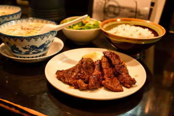 Beef tongue steak grilled serve with rice and vegetable, Sendai beef steak, tender, Local food in Sendai Japan, travel destinations meal. Japanese restaurant menu cookery.