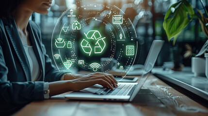 A businesswoman sits at a sleek desk, typing on a modern laptop. Above the laptop screen, a glowing virtual interface appears as clean, circular pop-up window. surrounded evenly by eco-friendly icons.