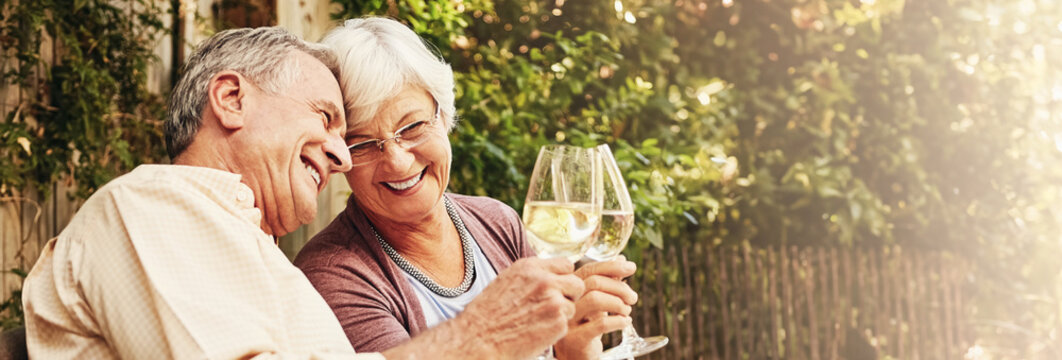 Cheers, senior couple and celebration with alcohol, romance and champagne for anniversary and love. Outdoor, care and commitment to marriage, elderly people and bonding with wine, backyard and home