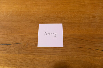 Handwritten pink note with 