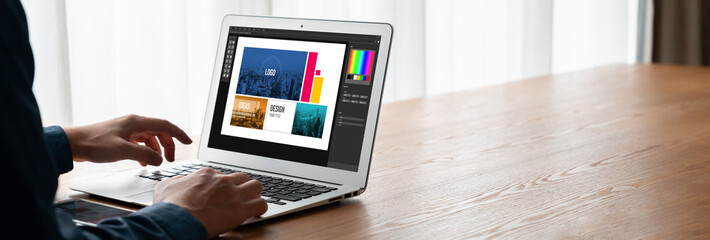 Graphic designer software for modern design of web page and commercial ads showing on the computer screen