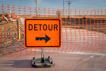 detour sign and barrier at a construction of a bike trail in Fort Collins, Colorado