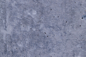 This textured concrete surface showcases unique patterns and imperfections that reveal its age and use.