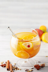 Homemade hot alcohol apple cider punch with cinnamon sticks, anise star and spices