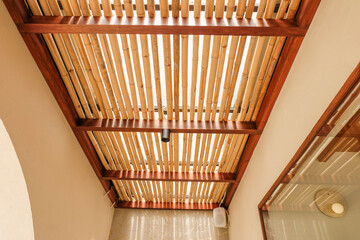 Obraz premium Bamboo pattern to prevent sun for Mediterranean shade,Bamboo mats on a roof,The walls are made of bamboo with sunlight,front view,copy space.