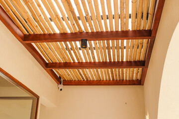 Bamboo pattern to prevent sun for Mediterranean shade,Bamboo mats on a roof,The walls are made of bamboo with sunlight,front view,copy space.