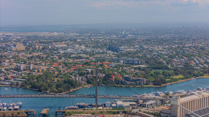 Aerial View of Sydney Harbour Balmain Darling harbour Sydney CBD cockle Bay Wharf North Sydney harbour bridge Lavender Bay Milsons Point Manly on a warm summer day blue skies 