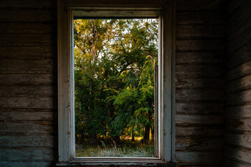 Wooden window frame in a dark room, a mystical concept