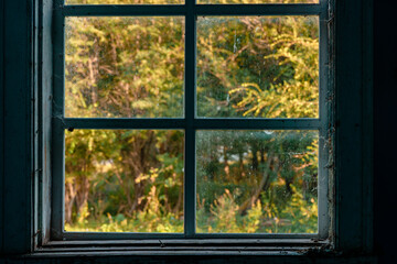 Wooden window frame in a dark room, a mystical concept