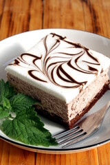 There is a large piece of cake on the plate.	