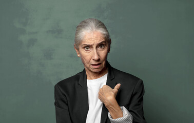  looking shocked and surprised with mouth wide open, pointing to self