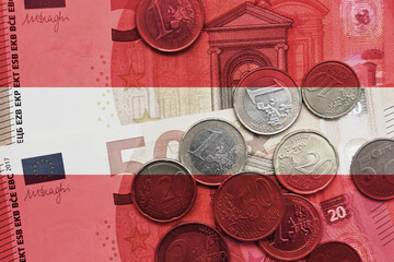 colourful national flag of austria on a euro money banknotes and coins background. finance concept.