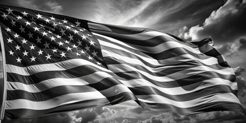 American Flag in Black and White Against Dramatic Cloudy Sky