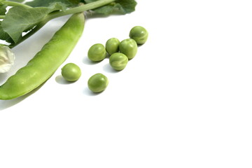 Green fresh peas lie on a white background.