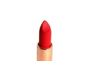 There is red lipstick on a white background.