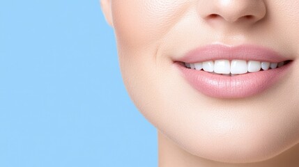 Obraz premium Captivating smile with natural beauty and glowing skin against a soft blue background for hair and beauty concepts