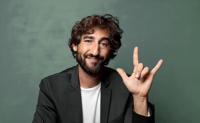  feeling happy, fun, confident, positive and rebellious, making rock or heavy metal sign with hand