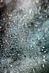 CLose Up of Condensation Bubbles and Marks on A Window Water Background