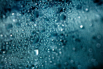 CLose Up of Condensation Bubbles and Marks on A Window Water Background