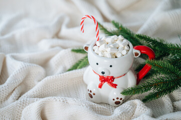 cocoa with marshmallows in a New Year's mug in the shape of a polar bear